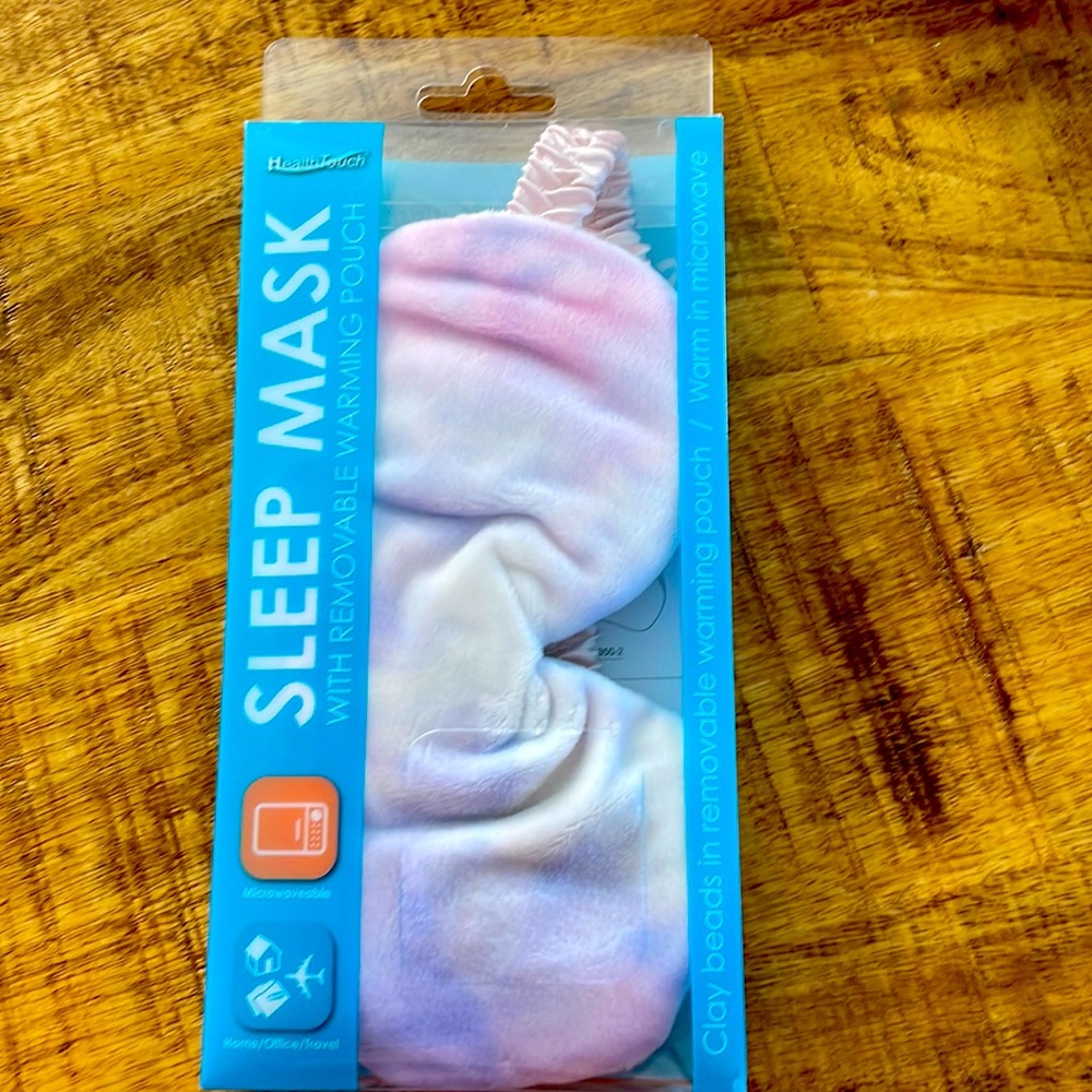 Sleep mask with removable warming pouch